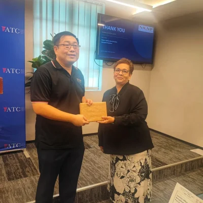 Ms Linda presenting a token of appreciation to Mr Ng Kian Nam after legal talk at ATC Penang